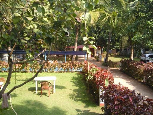 From main bldg, seen is fish pond, cottege Nos C6 & C7 and parking area